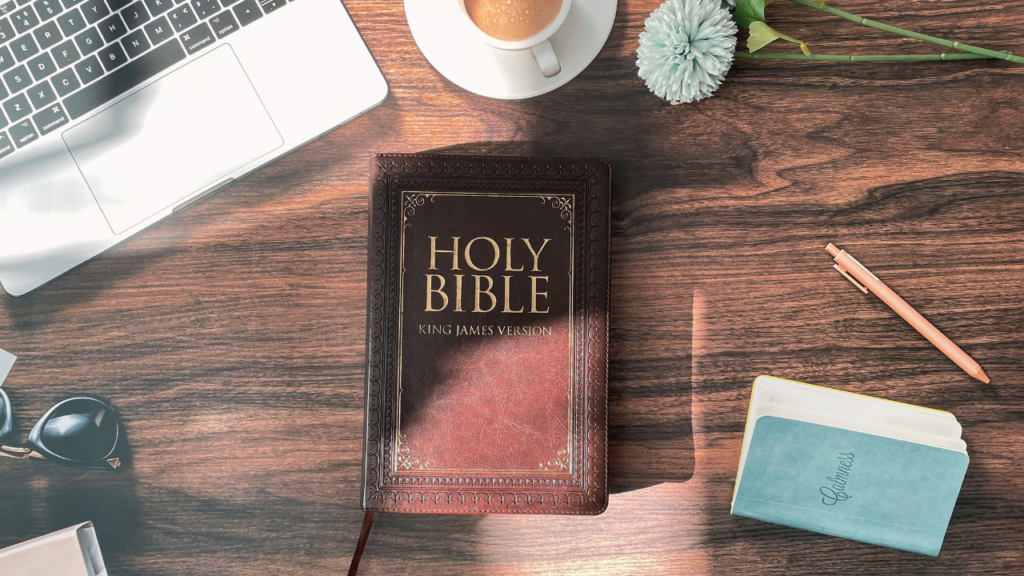 Biblical prophecy study — open KJV Bible on a desk with journal and coffee, preparing to study Scripture with discernment.