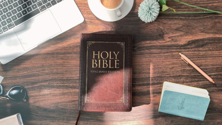 Biblical prophecy study — open KJV Bible on a desk with journal and coffee, preparing to study Scripture with discernment.
