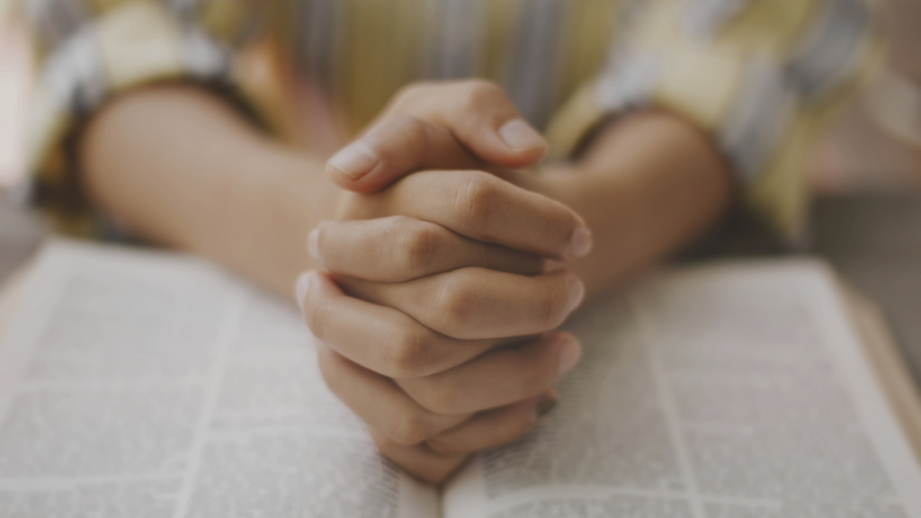 Christian woman in quiet reflection, offering spiritual encouragement for a man's faith journey without carrying his response