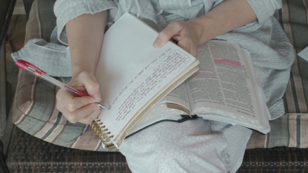 Christian woman practicing biblical discernment while studying Scripture and reflecting on difficult information